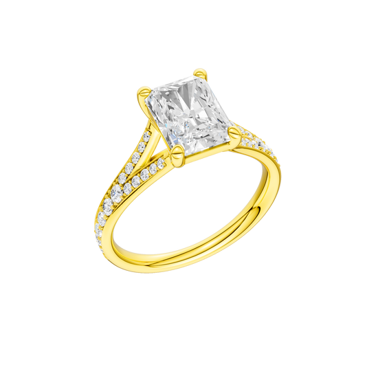 A three-quarter view of the Radiant cut diamond engagement ring in 14k gold gold with a diamond channel band and split setting