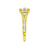 A side view of the Elongated Cushion cut diamond engagement ring in 14k yellow gold  with a channel band and hidden halo setting