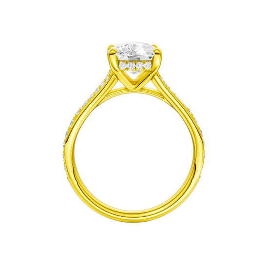 A profile view of the Elongated Cushion cut diamond engagement ring in 14k yellow gold  with a channel band and hidden halo setting
