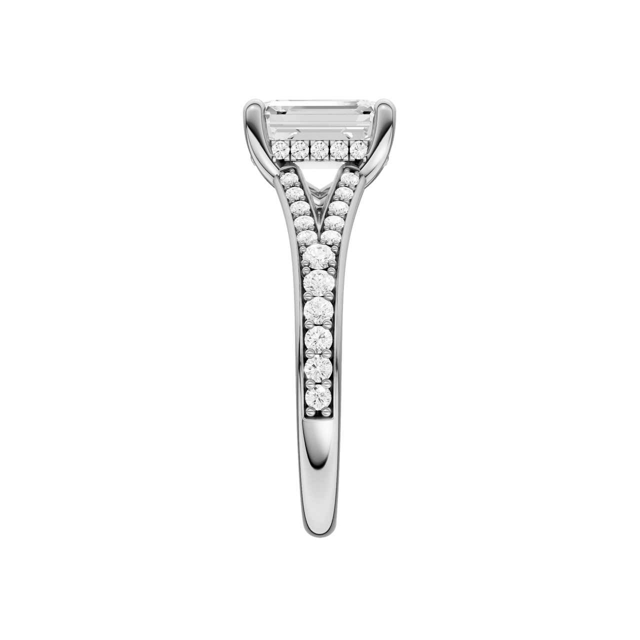 A side view of the Emerald cut diamond engagement ring in 14k white gold with a diamond channel band and split setting