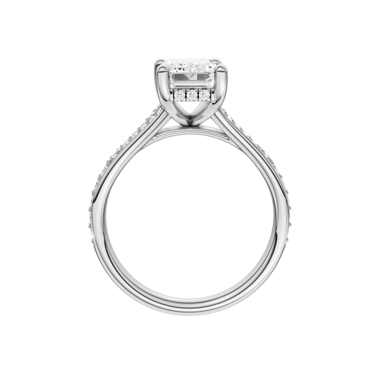 A profile view of the Emerald cut diamond engagement ring in 14k platinum with a diamond channel band and split setting