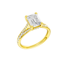 A three-quarter view of the Emerald cut diamond engagement ring in 14k yellow gold with a diamond channel band and split setting