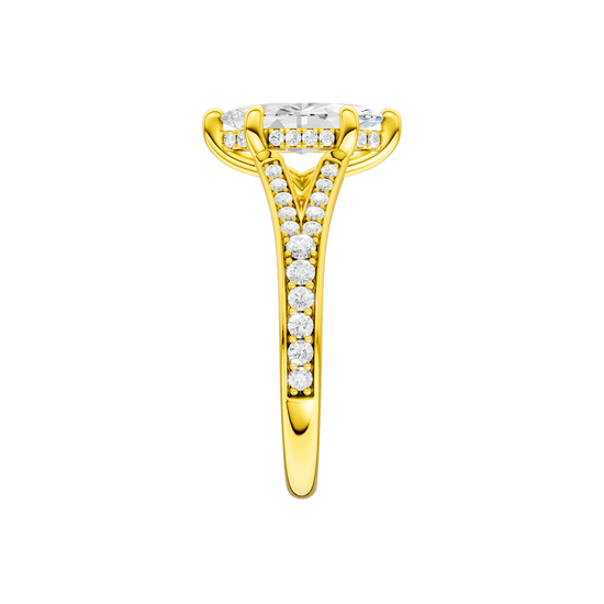 A side view of the Marquise cut diamond engagement ring in 14k yellow gold with a diamond channel band and split setting