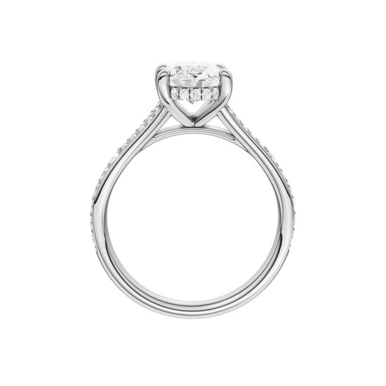 A profile view of the Oval cut diamond engagement ring in platinum with a channel band and hidden halo setting