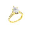 A three-quarter view of the Pear cut diamond engagement ring in 14k yellow gold with a channel band and cathedral setting
