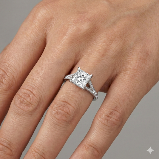Princess cut diamond engagement ring in 14k white gold with a diamond channel band and split setting on a hand