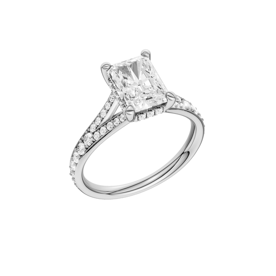 A three-quarter view of the Radiant cut diamond engagement ring in 14k white gold with a diamond channel band and split setting
