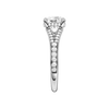 A side view of the Round cut diamond engagement ring in 14k white gold with a channel band and hidden halo setting