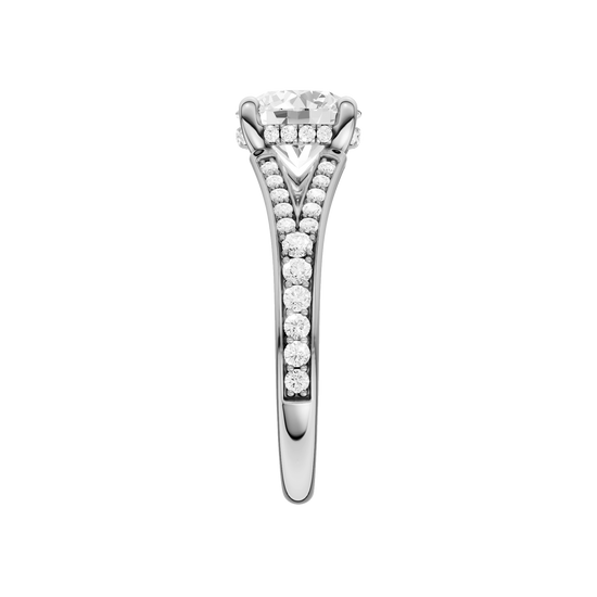 A side view of the Round cut diamond engagement ring in platinum gold with a channel band and hidden halo setting