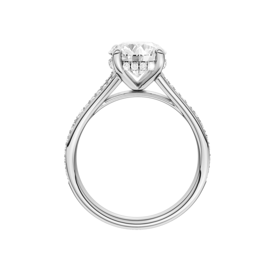 A profile view of the Round cut diamond engagement ring in platinum gold with a channel band and hidden halo setting