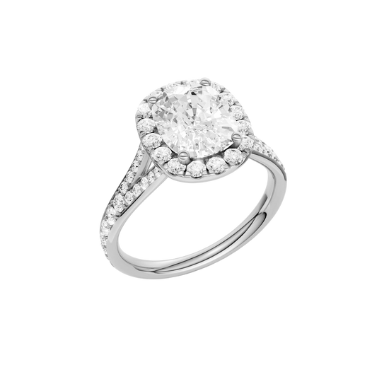 A three-quarter view of the Elongated cushion cut diamond engagement ring in platinum with a diamond channel band and split setting