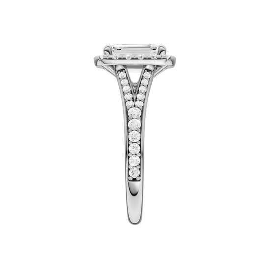 A side view of the Emerald cut diamond engagement ring in 14k white gold with a diamond channel band and split setting