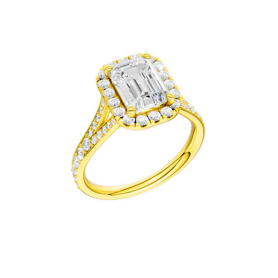 A three-quarter view of the Emerald cut diamond engagement ring in 14k yellow gold with a diamond channel band and split setting