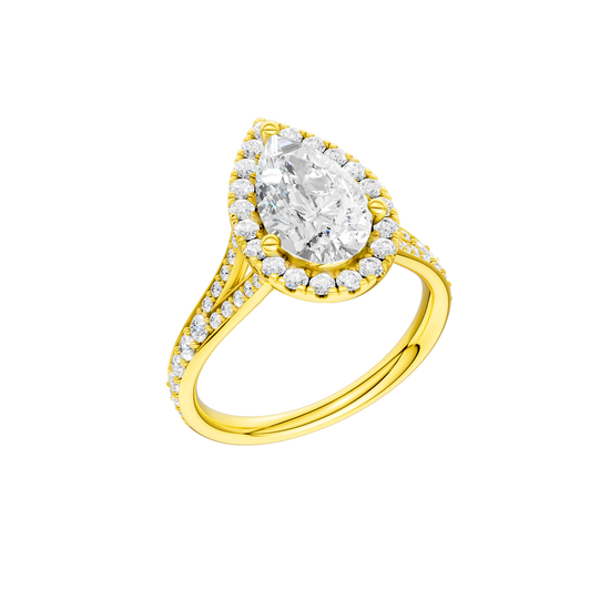 A three-quarter view of the Pear cut diamond engagement ring in 14k yellow gold with a diamond channel band and split setting