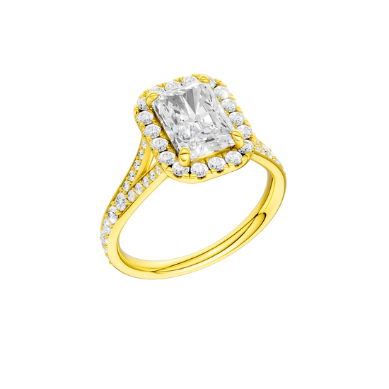 A three-quarter view of the Radiant cut diamond engagement ring in 14k yellow gold with a diamond channel band and split setting