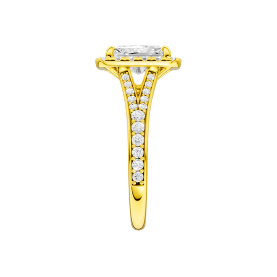 A side view of the Radiant cut diamond engagement ring in 14k yellow gold with a diamond channel band and split setting