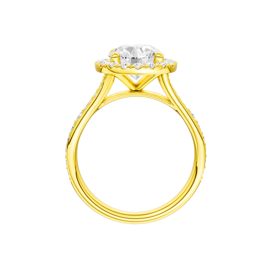 A profile view of the Round cut diamond engagement ring in 14k yellow gold with a diamond channel band and split setting