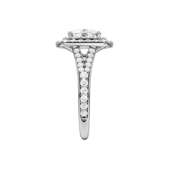 A side view of the Elongated Cushion cut diamond engagement ring in 14k white gold  with a channel band and double halo setting