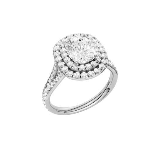 A three-quarter view of the Elongated Cushion cut diamond engagement ring in 14k white gold  with a channel band and double halo setting