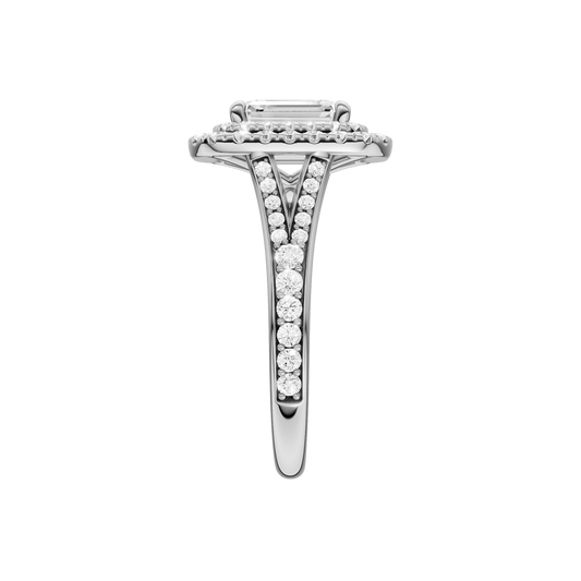 A side view of the Emerald cut diamond engagement ring in 14k white gold with a channel band and double halo setting