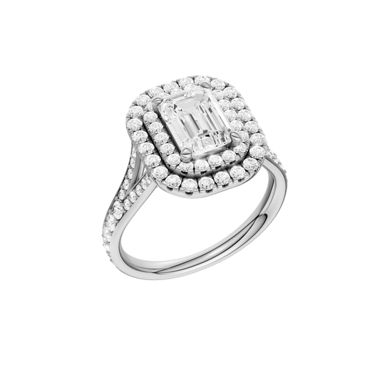 A three-quarter view of the Emerald cut diamond engagement ring in 14k white gold with a channel band and double halo setting