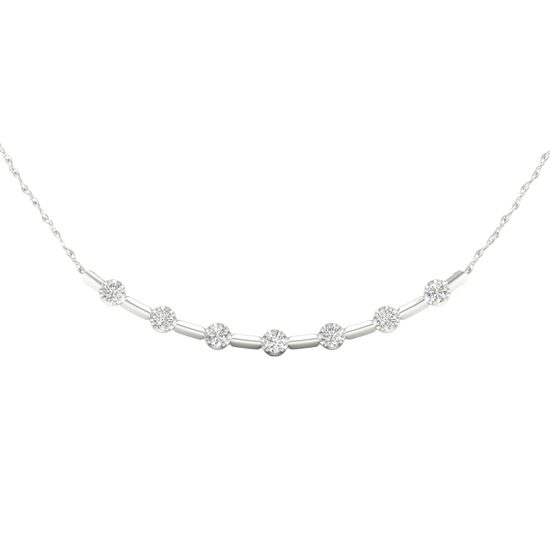 Close-up view of round white diamonds set in a white gold station necklace, highlighting stone clarity, setting detail, and polished white gold finish.
