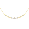 Close-up view of round white diamonds set in a yellow gold station necklace, highlighting diamond brilliance, setting detail, and polished gold finish.