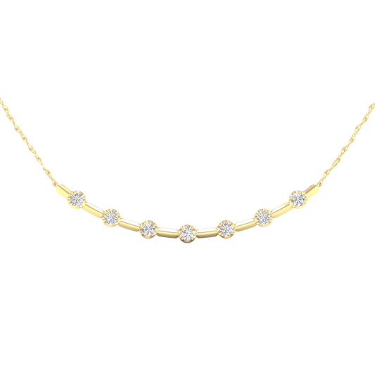 Close-up view of round white diamonds set in a yellow gold station necklace, highlighting diamond brilliance, setting detail, and polished gold finish.