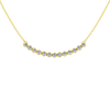 Up close front view of a yellow gold necklace featuring round white diamonds set along a gently curved design on a delicate chain.
