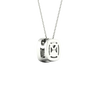 Back view of a white gold cushion cluster diamond pendant necklace showing a clean, polished backing and modern construction.