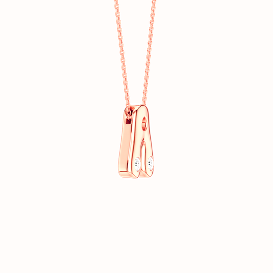 Amorati Diamond Bubble Pop Monogram A Initial Necklace in 14K rose gold. The pendant necklace with a minimalist, polished pendant featuring two small round lab grown diamonds, suspended from a delicate rose gold chain against a solid white background.
