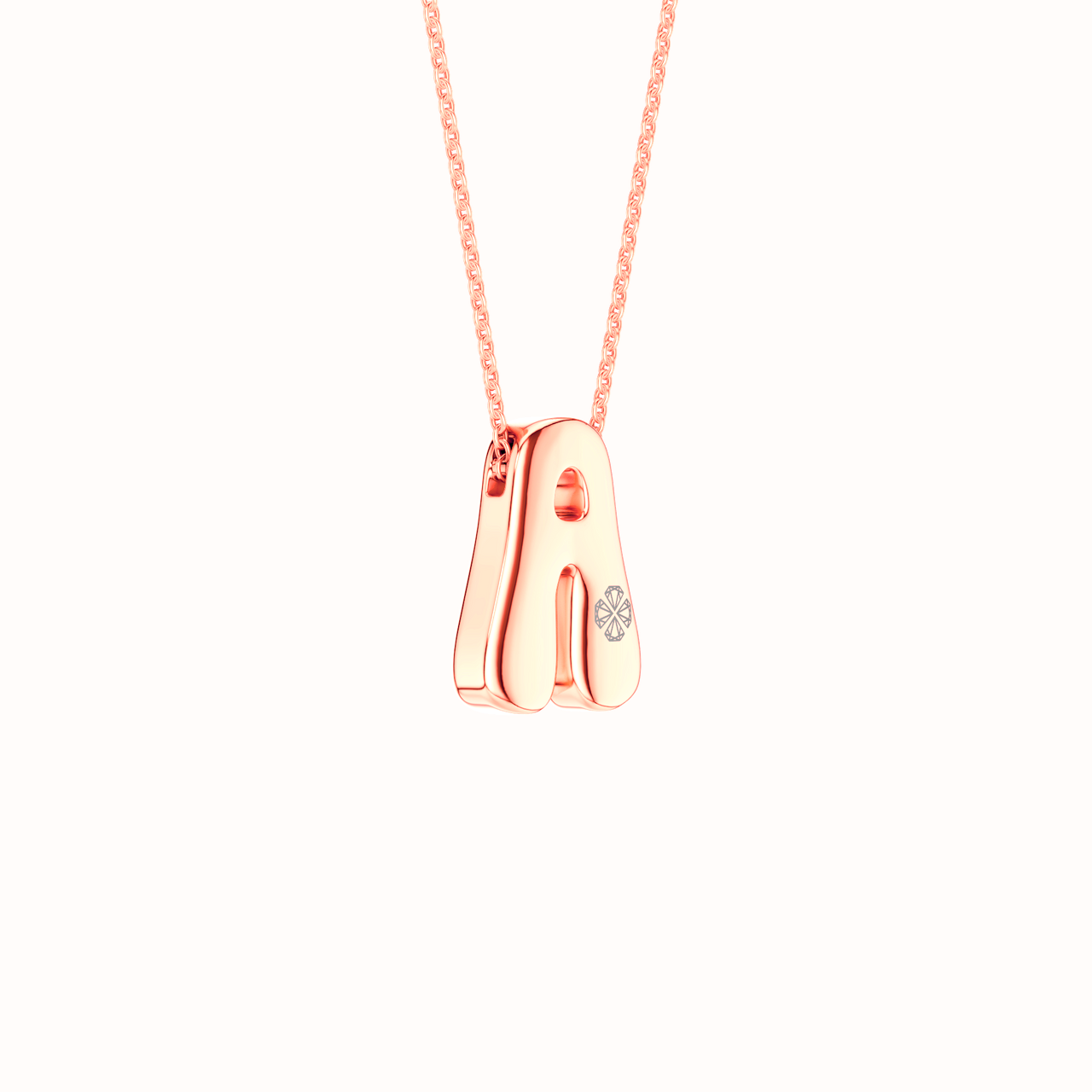Side view of the Amorati Diamond Bubble Pop Necklace in 14K rose gold. Initial pendant necklace featuring the letter 'A' adorned with a small lab grown diamonds, suspended from a delicate rose gold chain against a solid white background.