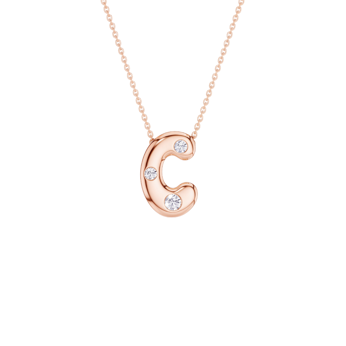 A rose gold letter 'C' pendant necklace with three small clear gemstones, suspended from a delicate matching chain against a solid white background.