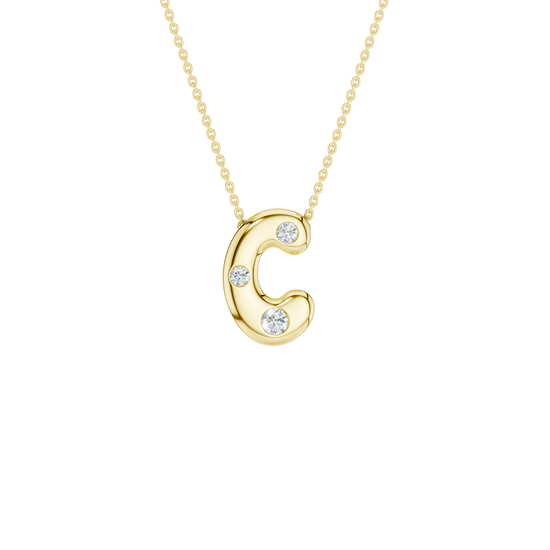 Modern 14k yellow gold bubble letter C initial necklace studded with three brilliant round-cut flush-set white diamonds on a delicate cable chain.