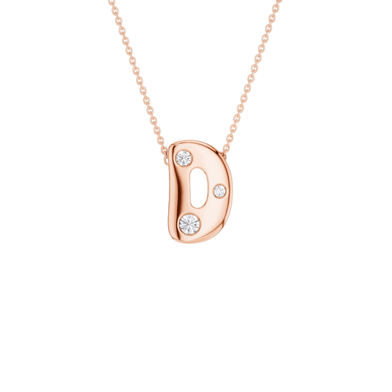 A rose gold initial pendant necklace featuring the letter 'D' adorned with three clear round-cut gemstones, suspended from a delicate matching rose gold chain against a solid white background.