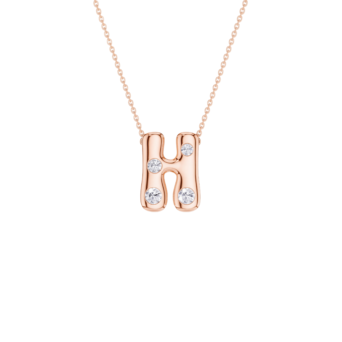A rose gold initial necklace featuring the letter 'H' adorned with three clear round-cut gemstones, suspended from a delicate matching chain against a solid white background.