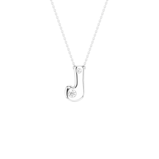 A silver initial pendant necklace featuring the letter 'J' adorned with a small floral design and a tiny round gemstone, suspended from a delicate silver ball chain against a solid white background.