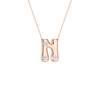 A rose gold initial necklace featuring the letter 'N' adorned with three clear round-cut gemstones, suspended from a delicate matching chain against a solid white background.