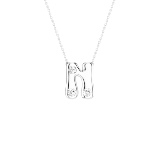 A silver letter 'N' pendant necklace with three clear round-cut gemstones, suspended from a delicate silver chain against a solid white background.
