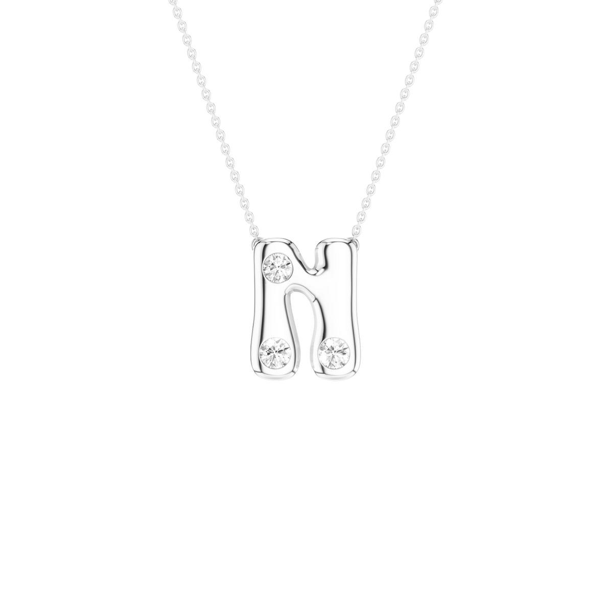 A silver letter 'N' pendant necklace with three clear round-cut gemstones, suspended from a delicate silver chain against a solid white background.