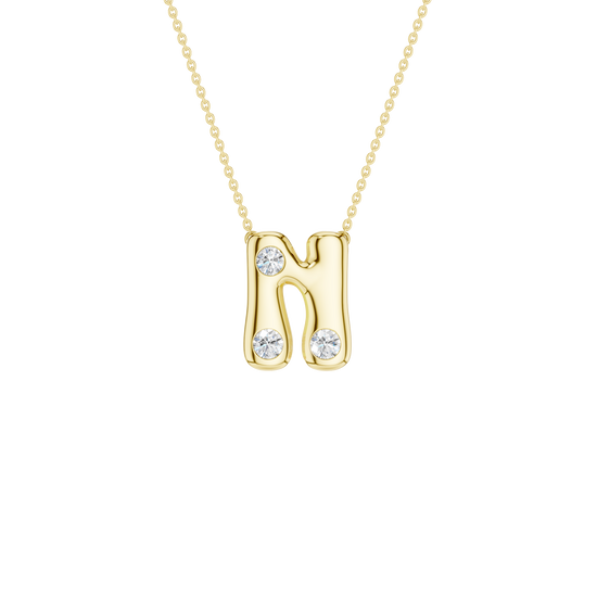 A product shot of a yellow gold necklace featuring a fine cable chain attached to the top curves of a smooth, bubble-font letter 'N' pendant. The polished gold 'N' is embellished with three sparkling, flush-set round diamonds: one placed on the upper left stem, one at the bottom left stem, and one at the bottom right stem.
