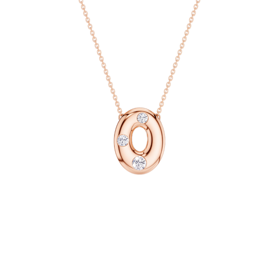 A rose gold oval pendant necklace featuring a cutout center and three small clear gemstones, suspended from a delicate matching chain against a solid white background.