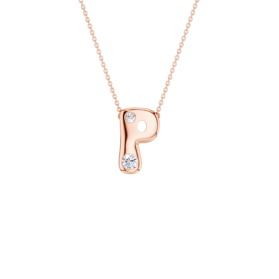 A rose gold initial pendant necklace featuring the letter 'P' adorned with two small clear gemstones, suspended from a delicate matching chain against a solid white background.