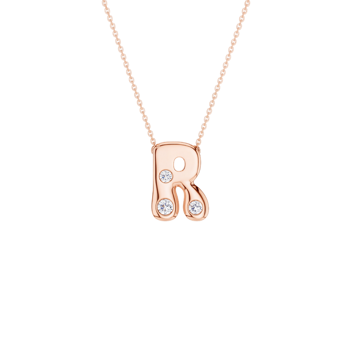 A rose gold initial necklace featuring the letter 'R' adorned with three small clear round-cut gemstones, suspended from a delicate matching chain against a solid white background.