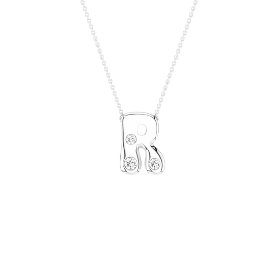 A rose gold initial necklace featuring the letter 'R' adorned with three small clear round-cut gemstones, suspended from a delicate matching chain against a solid white background.