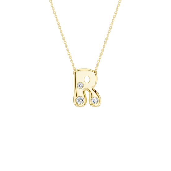 Modern 14k yellow gold bubble letter R initial necklace studded with three brilliant round-cut flush-set white diamonds on a delicate cable chain.