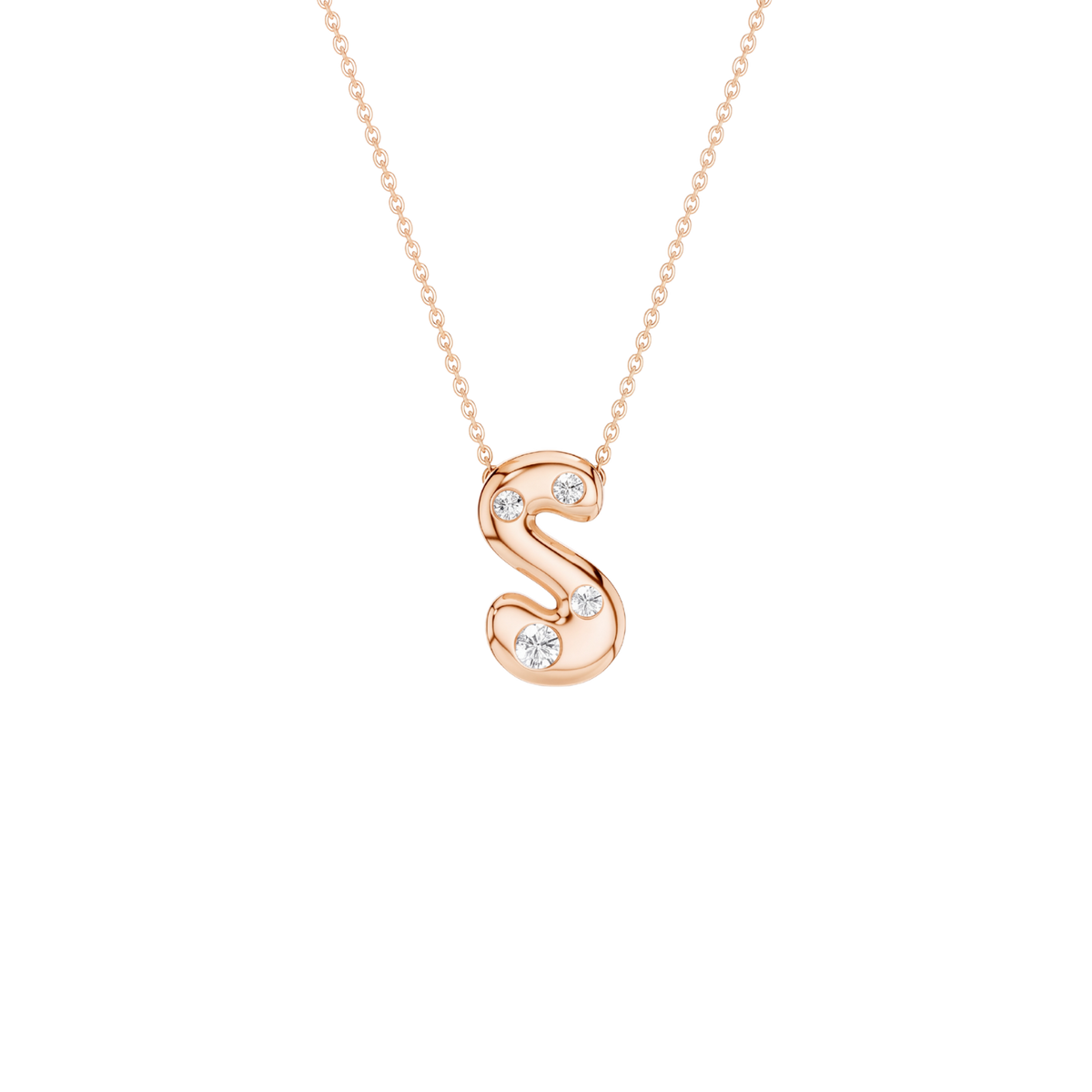 A rose gold initial pendant necklace featuring the letter 'S' adorned with three small clear gemstones, suspended from a delicate matching chain against a solid white background.