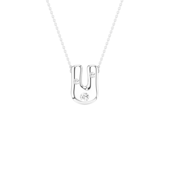 A silver U-shaped pendant necklace with three small clear gemstones, shown on a delicate silver chain against a solid white background.
