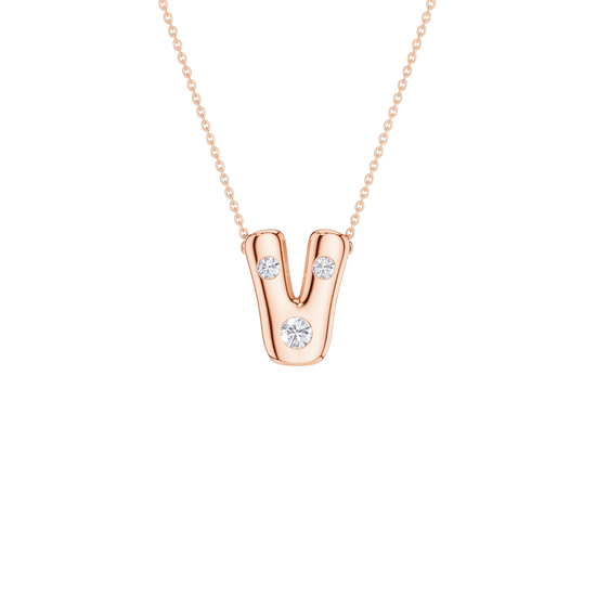 A rose gold initial pendant necklace featuring the letter 'V' adorned with three clear round-cut gemstones, suspended from a delicate rose gold cable chain against a solid white background.