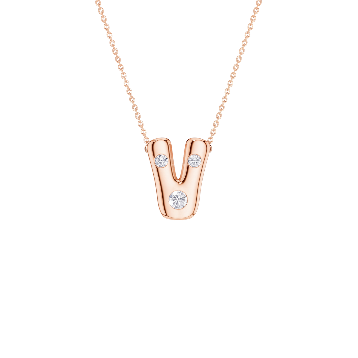 A rose gold initial pendant necklace featuring the letter 'V' adorned with three clear round-cut gemstones, suspended from a delicate rose gold cable chain against a solid white background.
